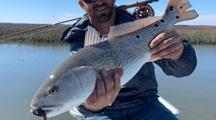 Island Fishing Charters angler with a redfish