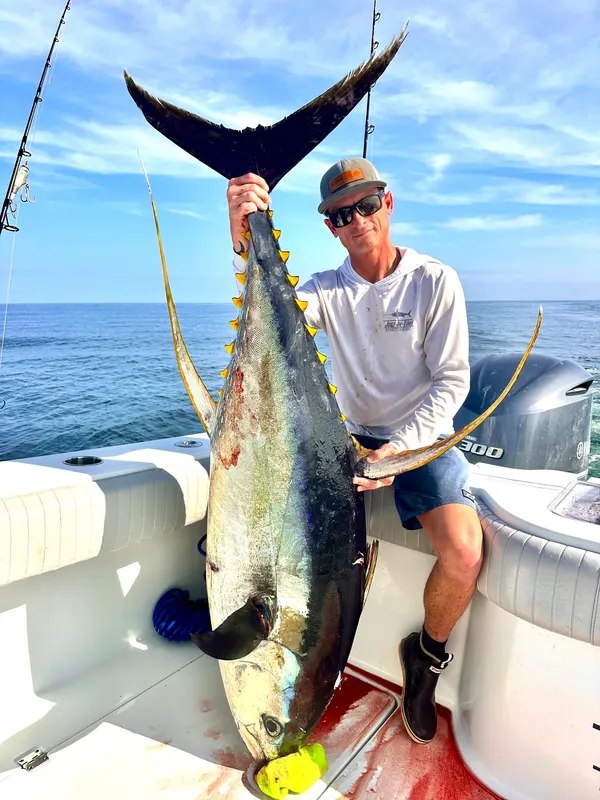 JIT Charters guest displaying a yellowfin tuna