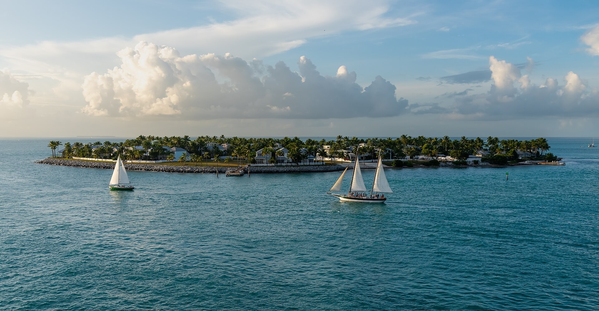 Sailboats passing Sunset Key beside Key West
