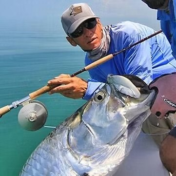 Miami Flats tarpon beside a fly fishing rod