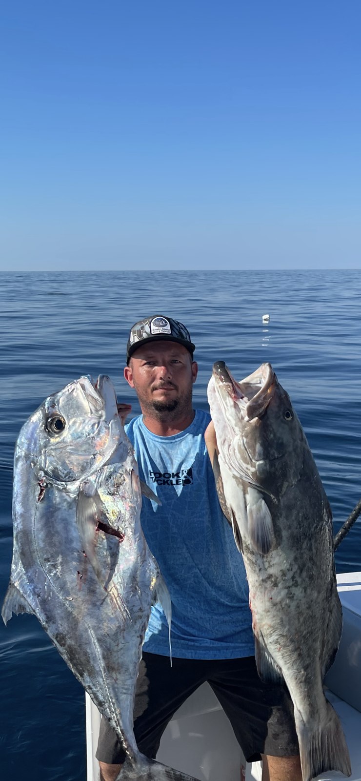 Reel Amelia angler displaying two fish aboard the charter boat