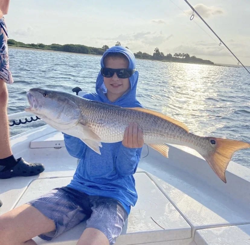 Salt Obsession guest displaying a redfish