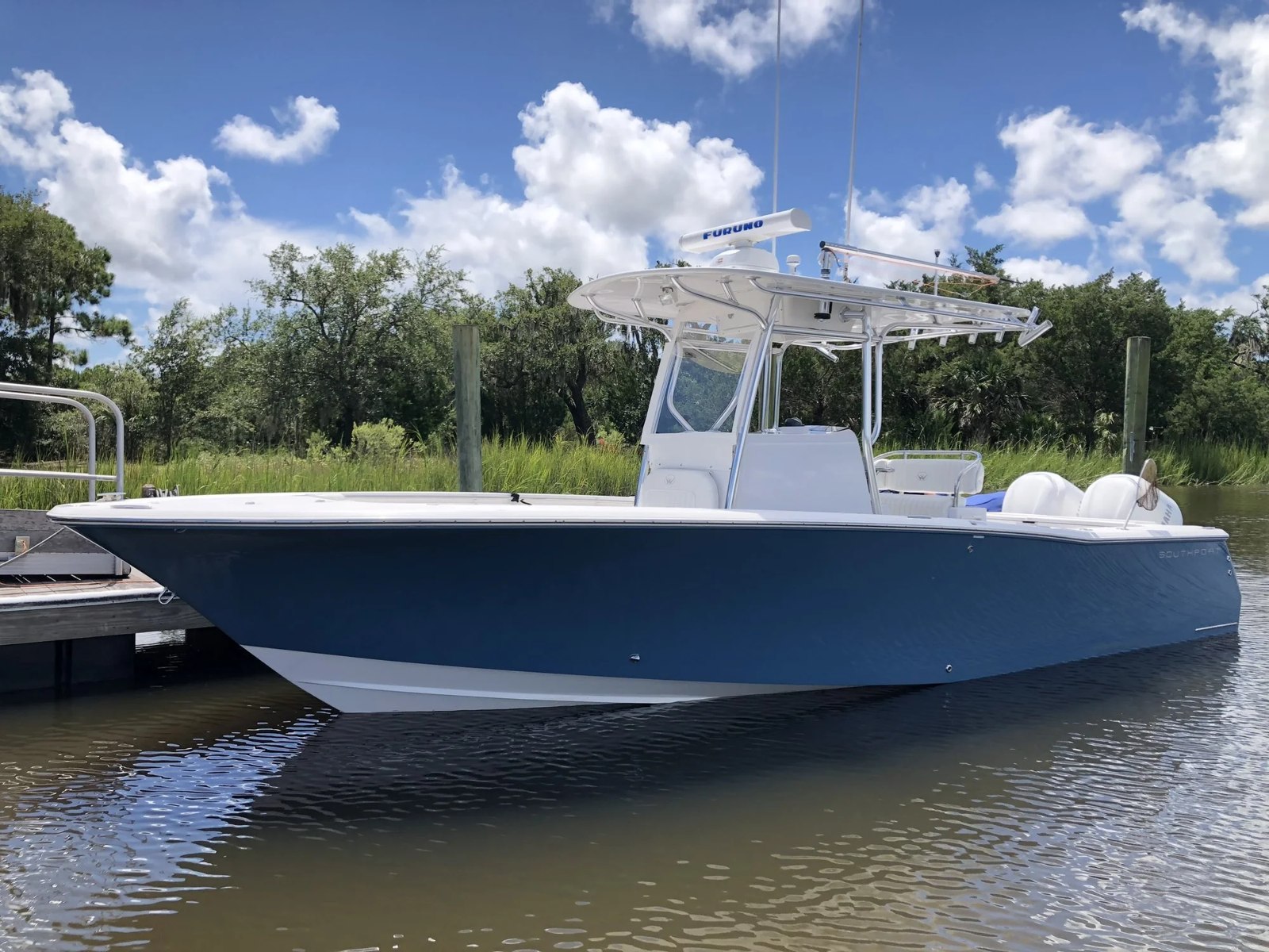 Southern Star Southport center-console fishing boat beside a dock