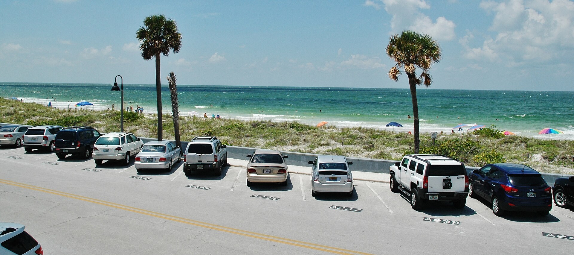 Gulf beach, palms and waterfront parking in St. Pete Beach in August 2012