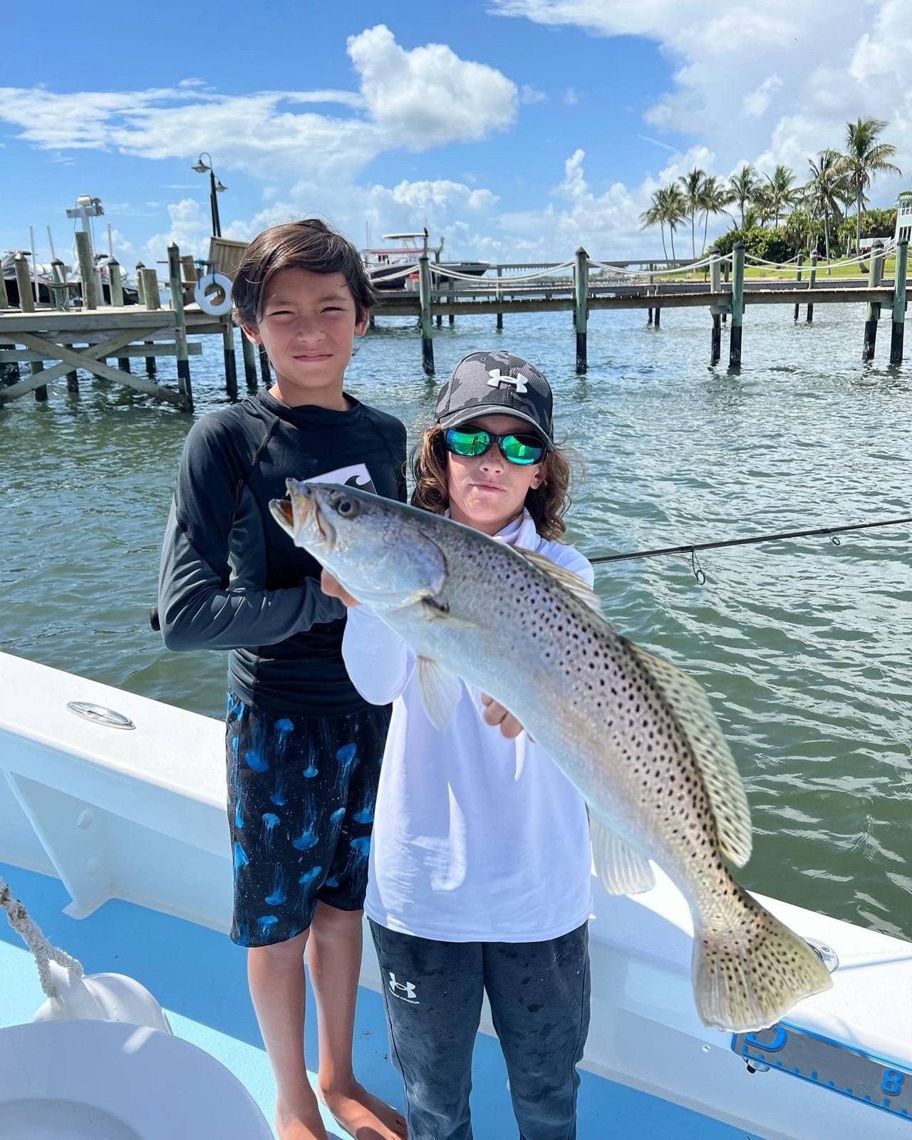 Sweet Relief Charters young anglers displaying a spotted seatrout