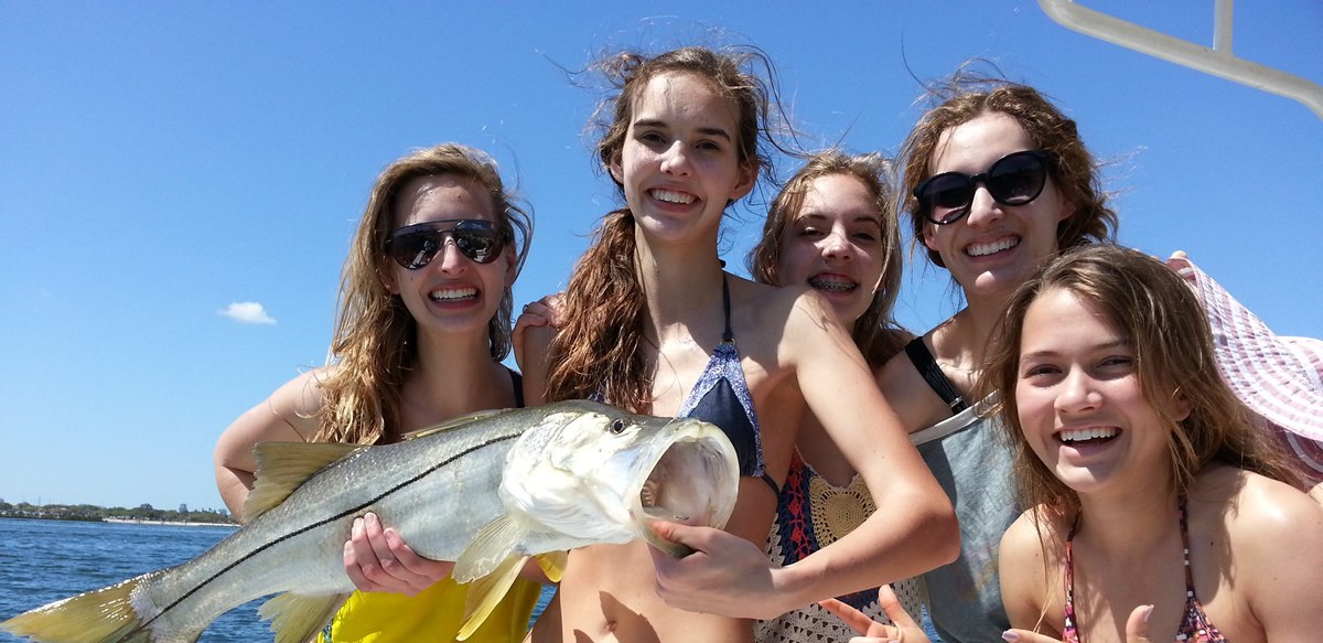 Tampa Fishing Charters group displaying a large snook