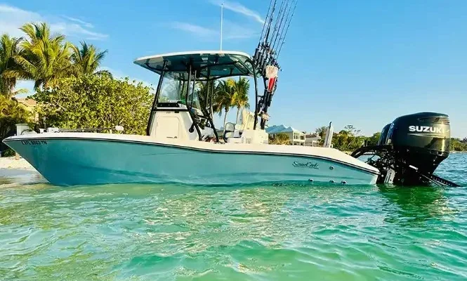 Teal Water Charter Company fishing boat anchored in shallow water