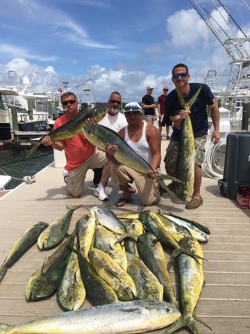 TomCat Sportfishing anglers with a dockside catch