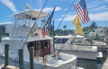 Triple X Charters Over It All sportfishing boat at the marina
