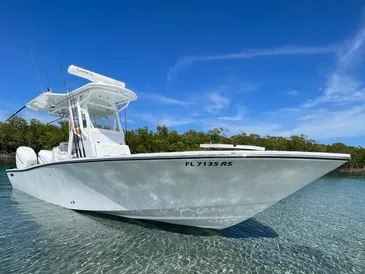 Uno Mas Charters center console on a trailer