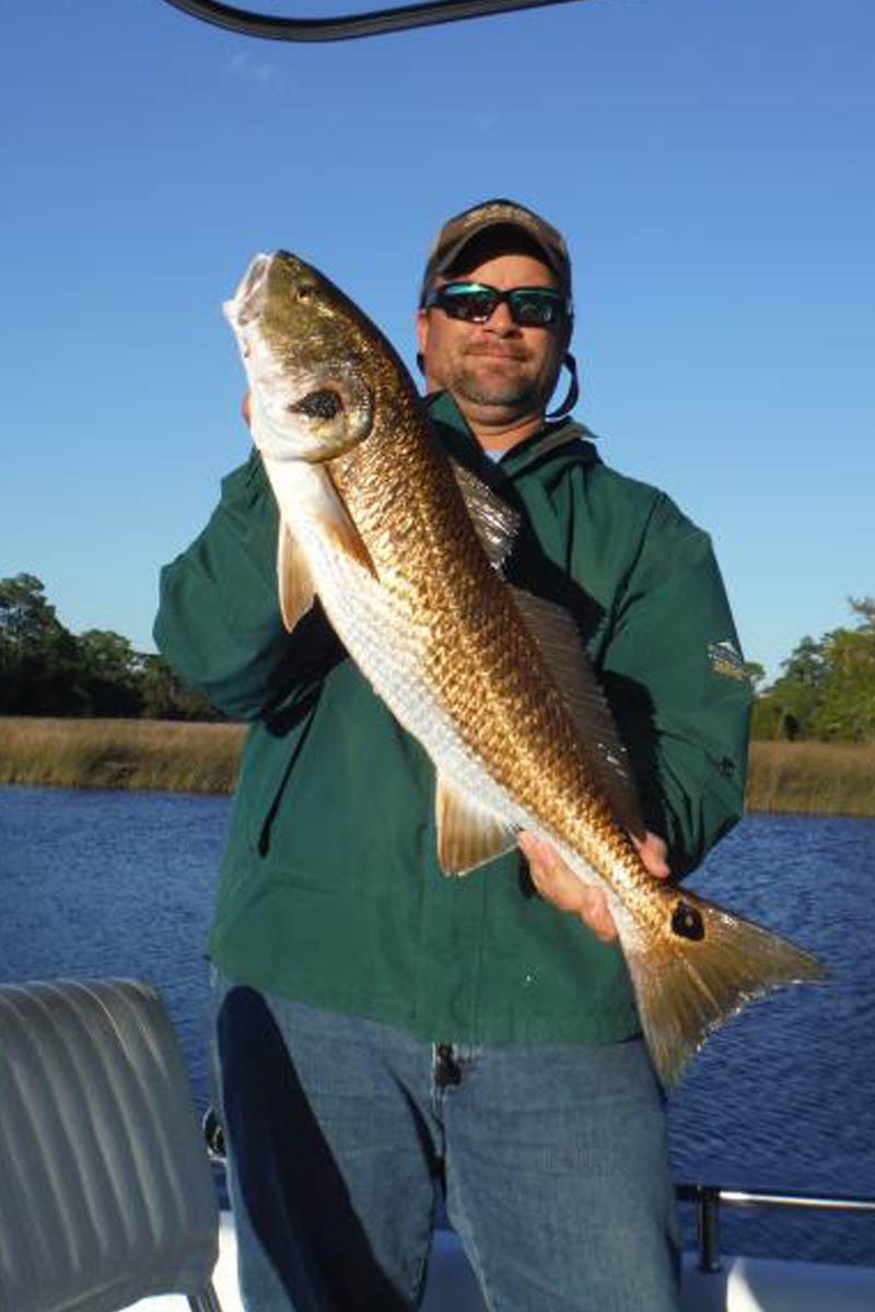 Up the Limit angler displaying a redfish