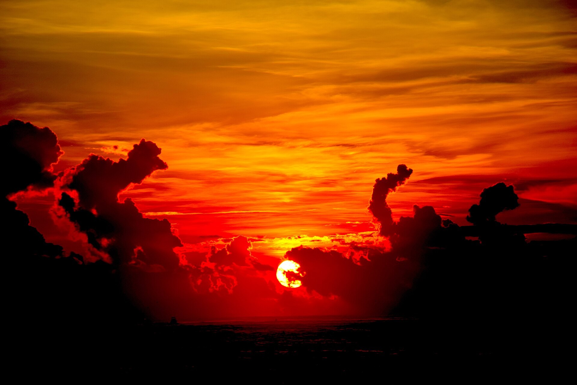 Orange sunset clouds photographed from the Point at Vilano Beach