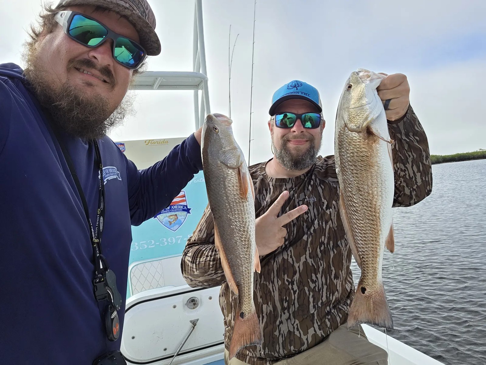 Weeki Wachee Fish Company anglers displaying redfish aboard the boat