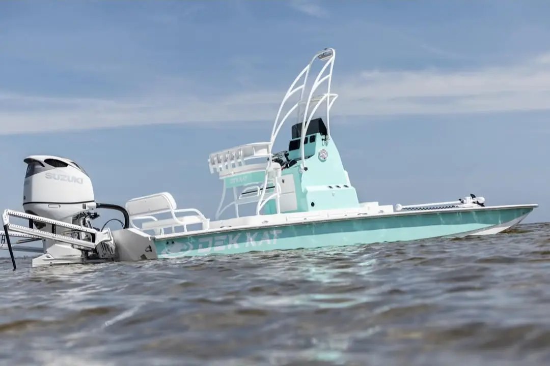 Weeki Wachee Fish Company mint green Dek Kat fishing boat on Gulf water