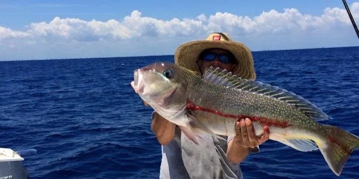 Weekley Rehab guest showing a snapper at sea