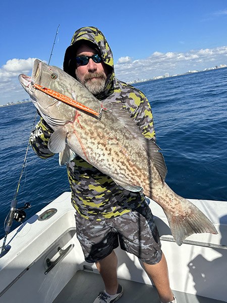YB Normal angler holding a grouper