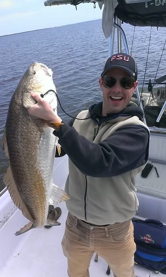 YKnotFish angler displaying a spotted seatrout